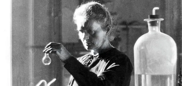 Marie Curie portrait with subtle laboratory ambience — physicist and chemist, featured in Profilia biographies collection.